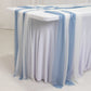 Dusty blue and ivory sheer table runners draped on a white table.