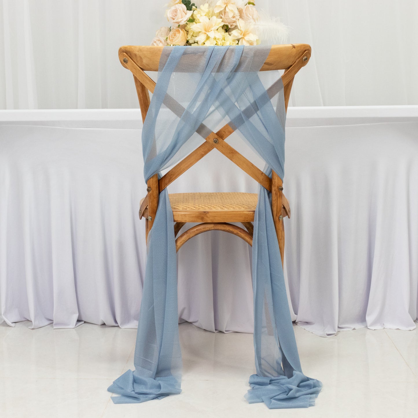 Dusty blue sheer chair drape decor with shimmer sash, wrinkle-free design.