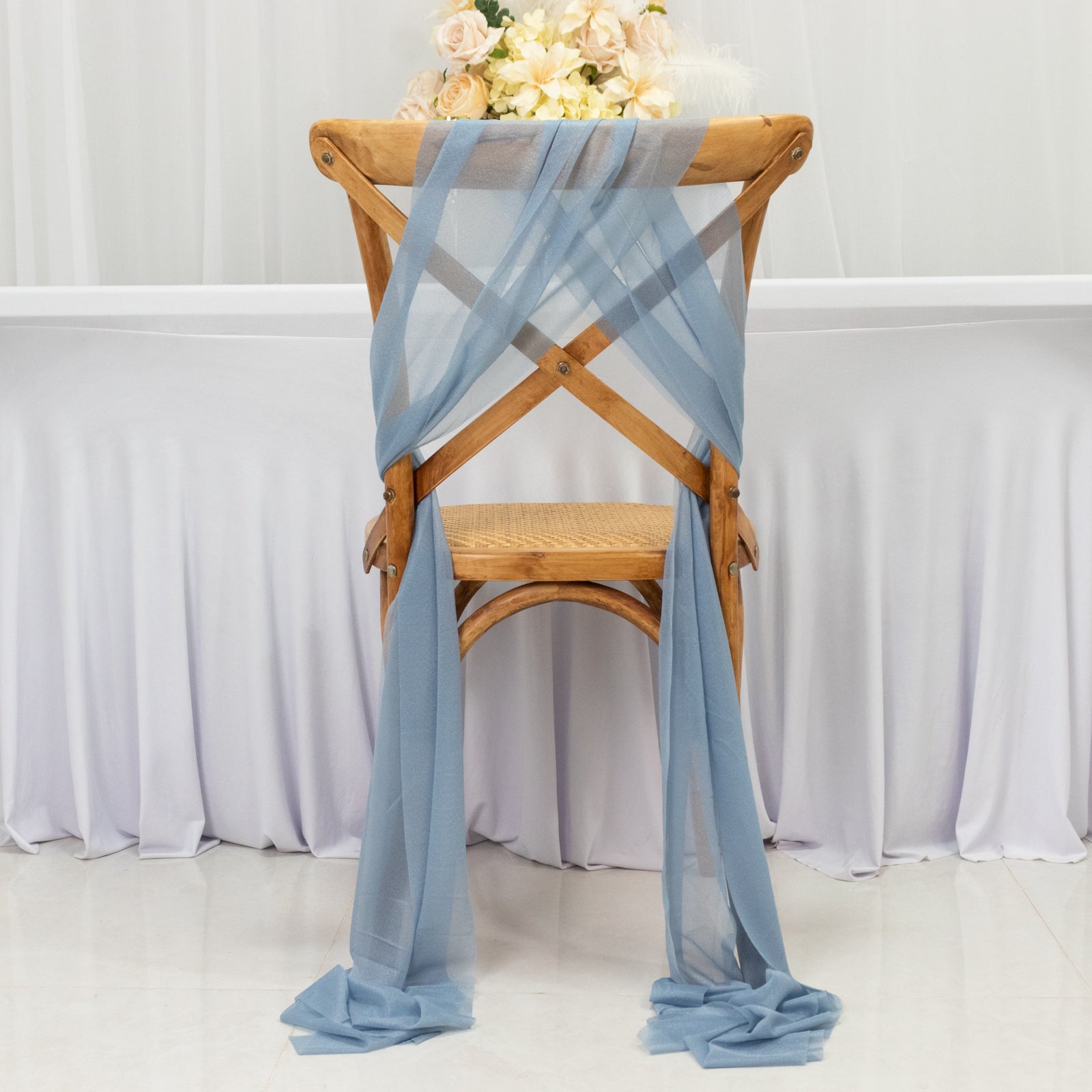 Dusty blue sheer chair drape decor with shimmer sash, wrinkle-free design.