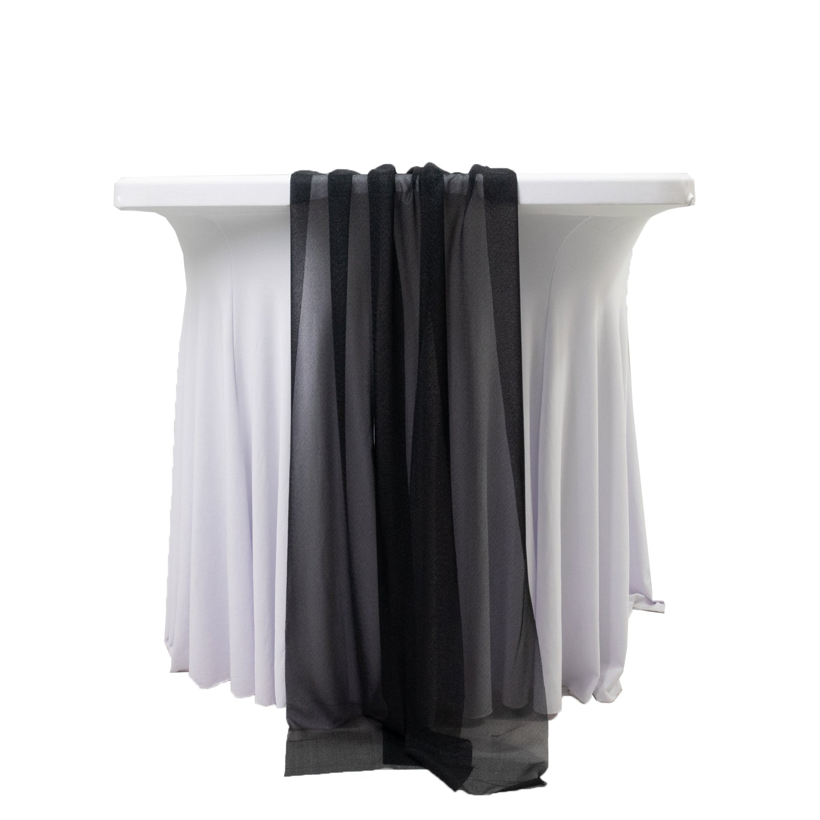 Black sheer table runners draped elegantly over a white table.