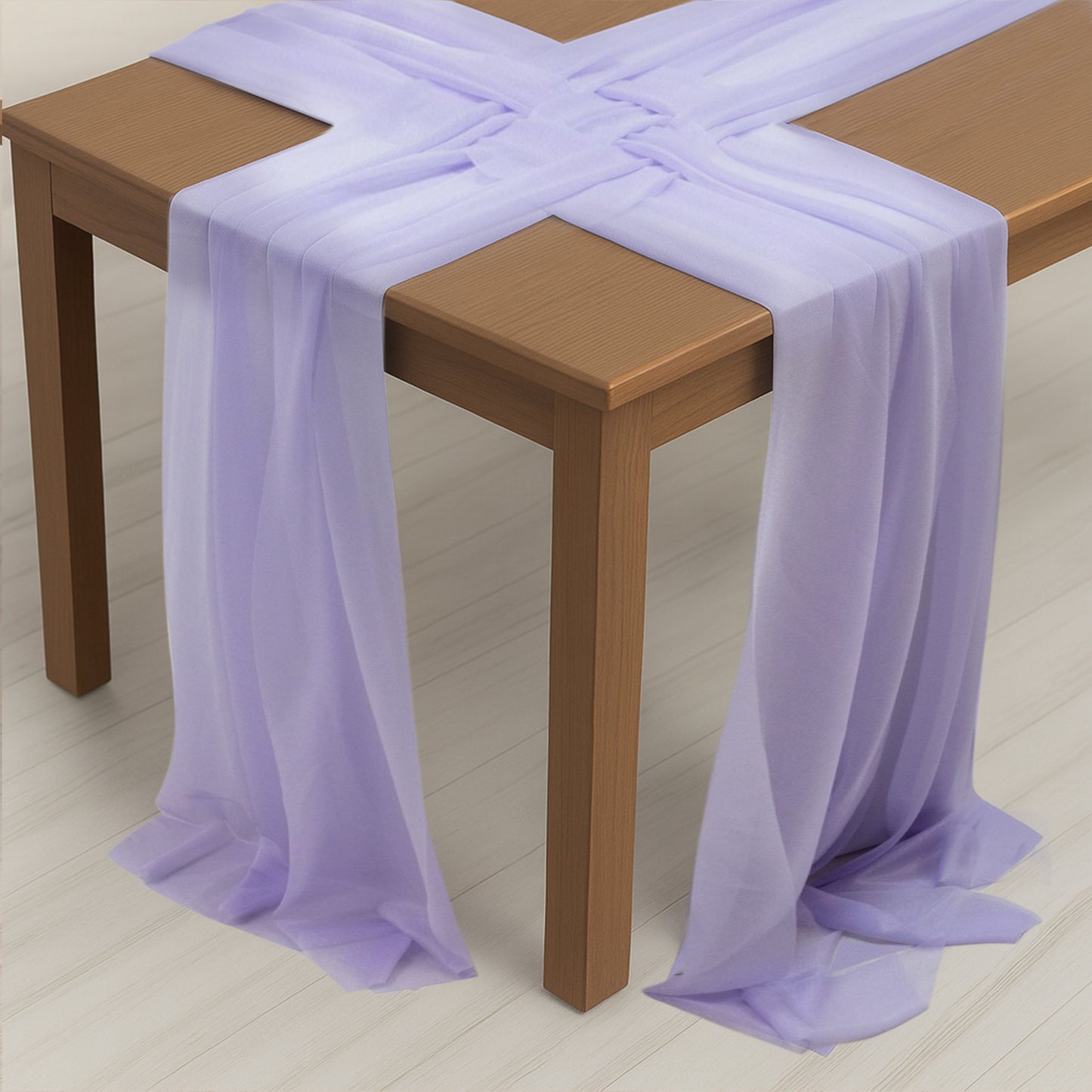 Lavender lilac shimmer sheer table runners draped over a wooden table.