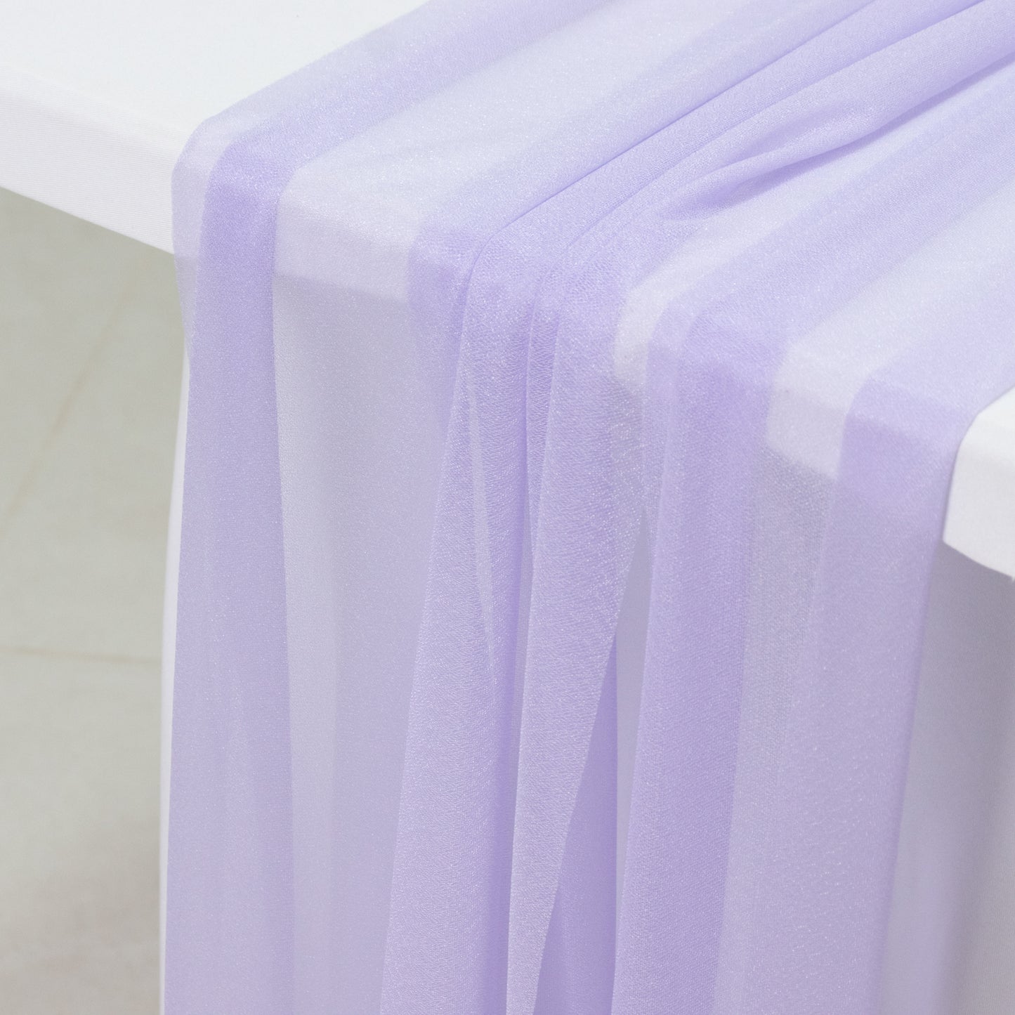 Lavender sheer table runner drapes for elegant events and decor.