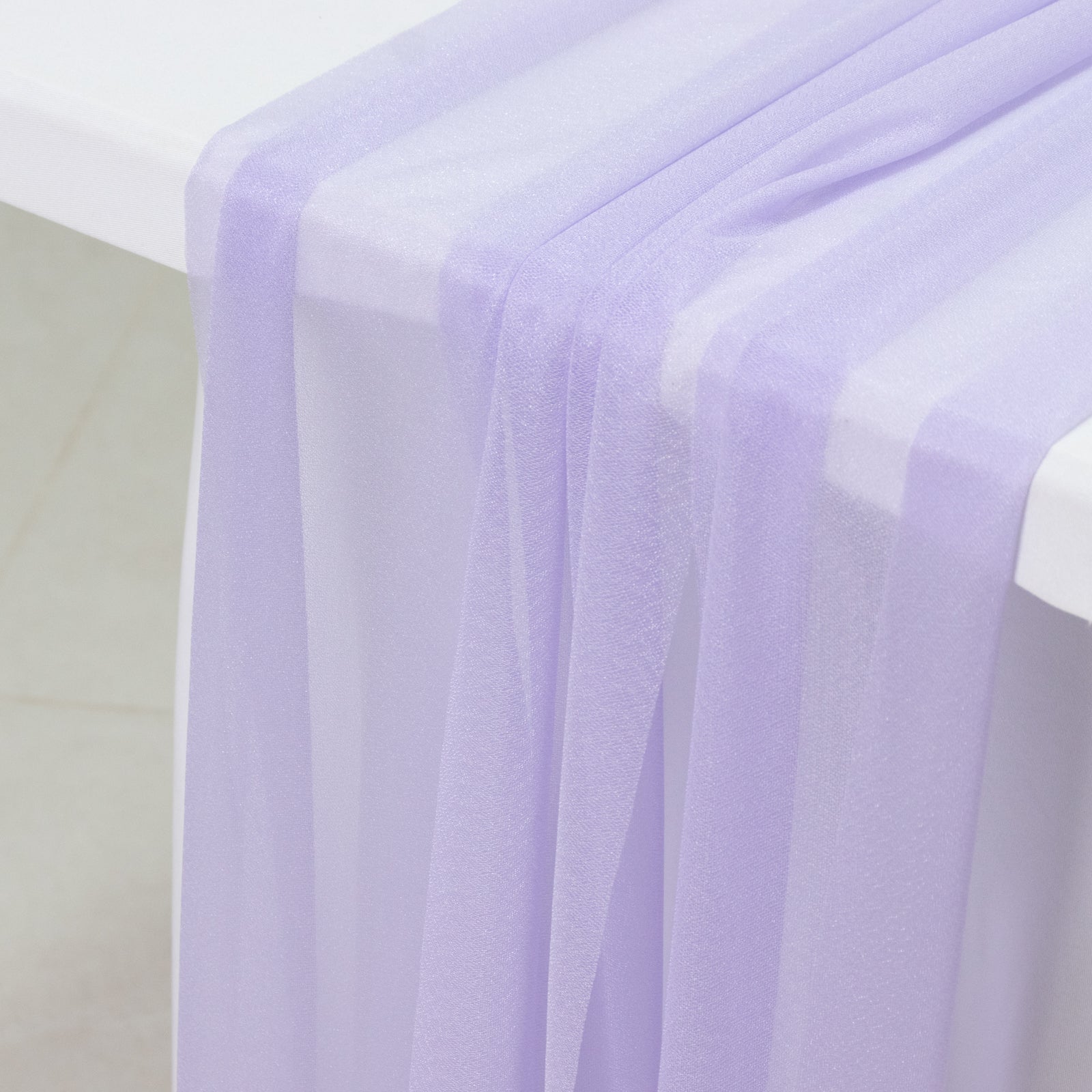Lavender sheer table runner drapes for elegant events and decor.