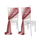 Mauve and blush sheer chair drapes on white chairs.