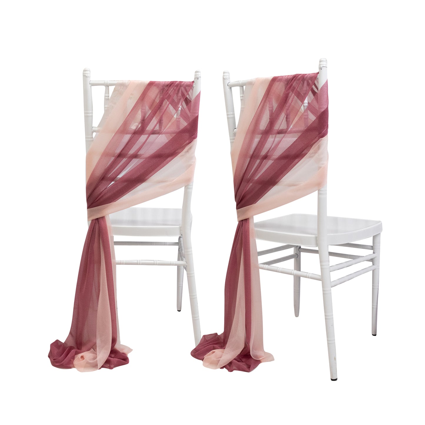 Mauve and blush sheer chair drapes on white chairs.