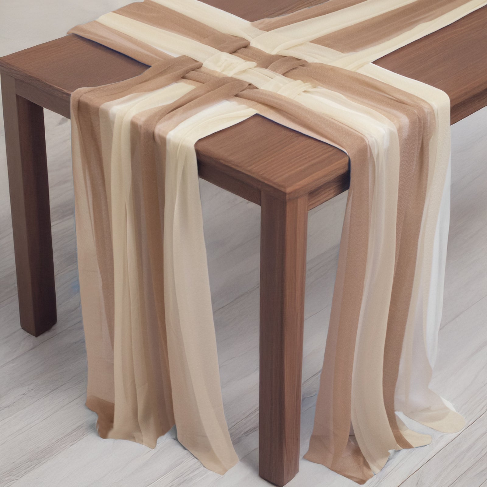 Taupe and beige shimmer sheer table runners on a wooden table.
