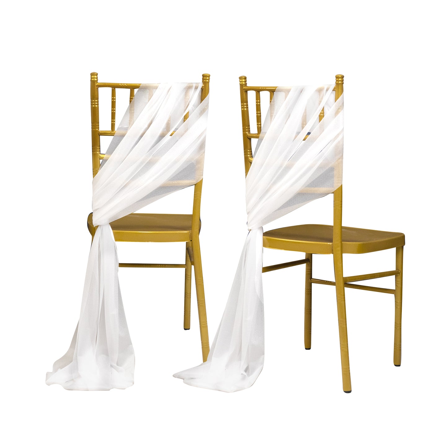 White sheer chair drapes on gold chairs, creating an elegant decor.