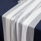 White shimmer sheer table runners on a dark tablecloth.