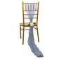 Dusty blue sheer crinkled organza chair sash draped on a gold chair. #whtbkgd