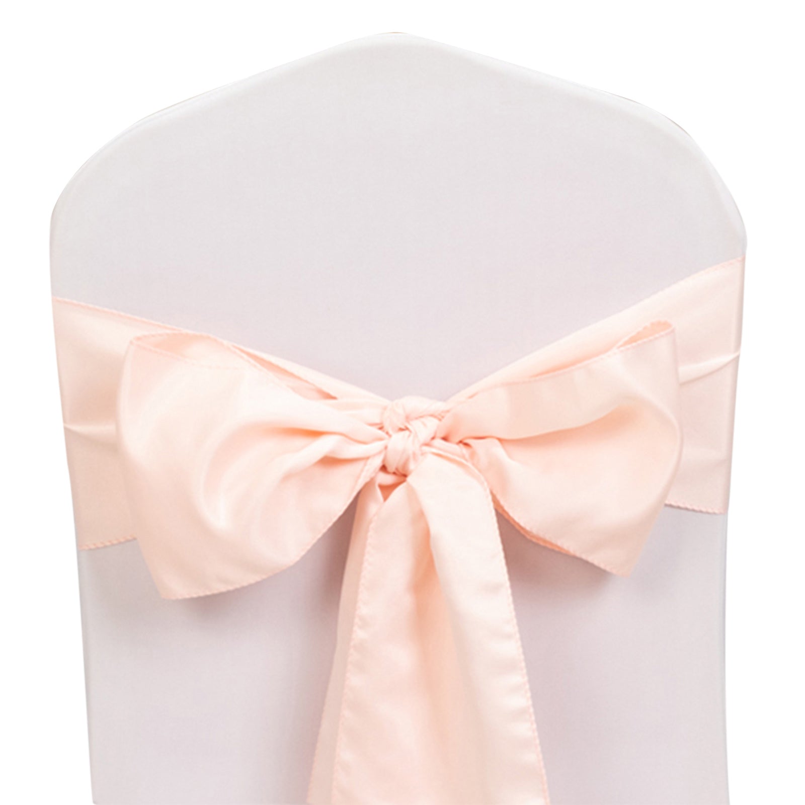 Blush satin chair sash bow on a white chair.