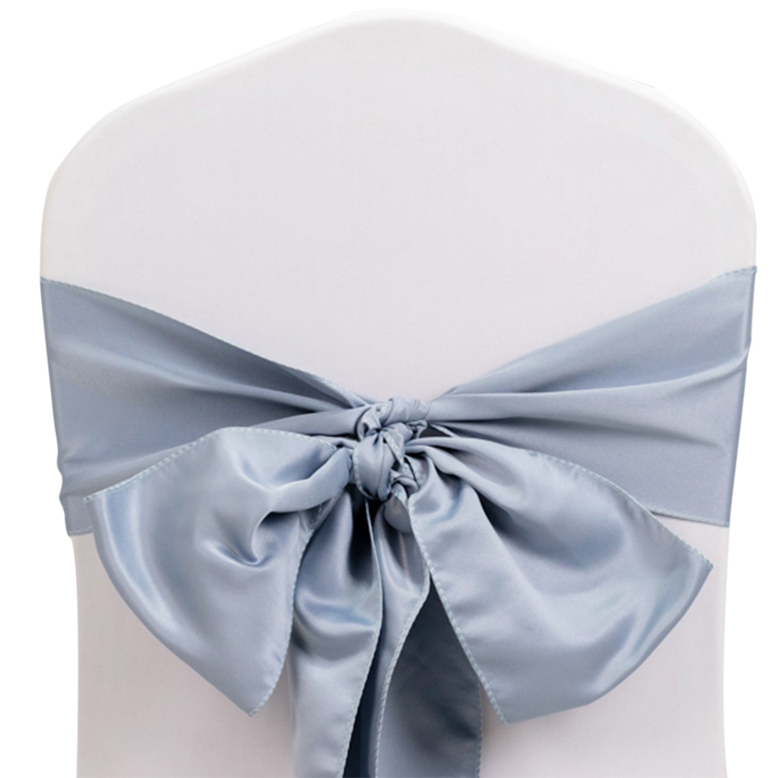 Dusty blue satin chair sash tied in a bow on a white chair.