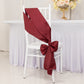 Burgundy satin chair sashes elegantly tied on a white chair.