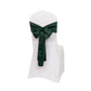 Emerald green satin chair sash bow on a white chair.
