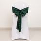 Emerald green satin chair sash bow on a white chair.