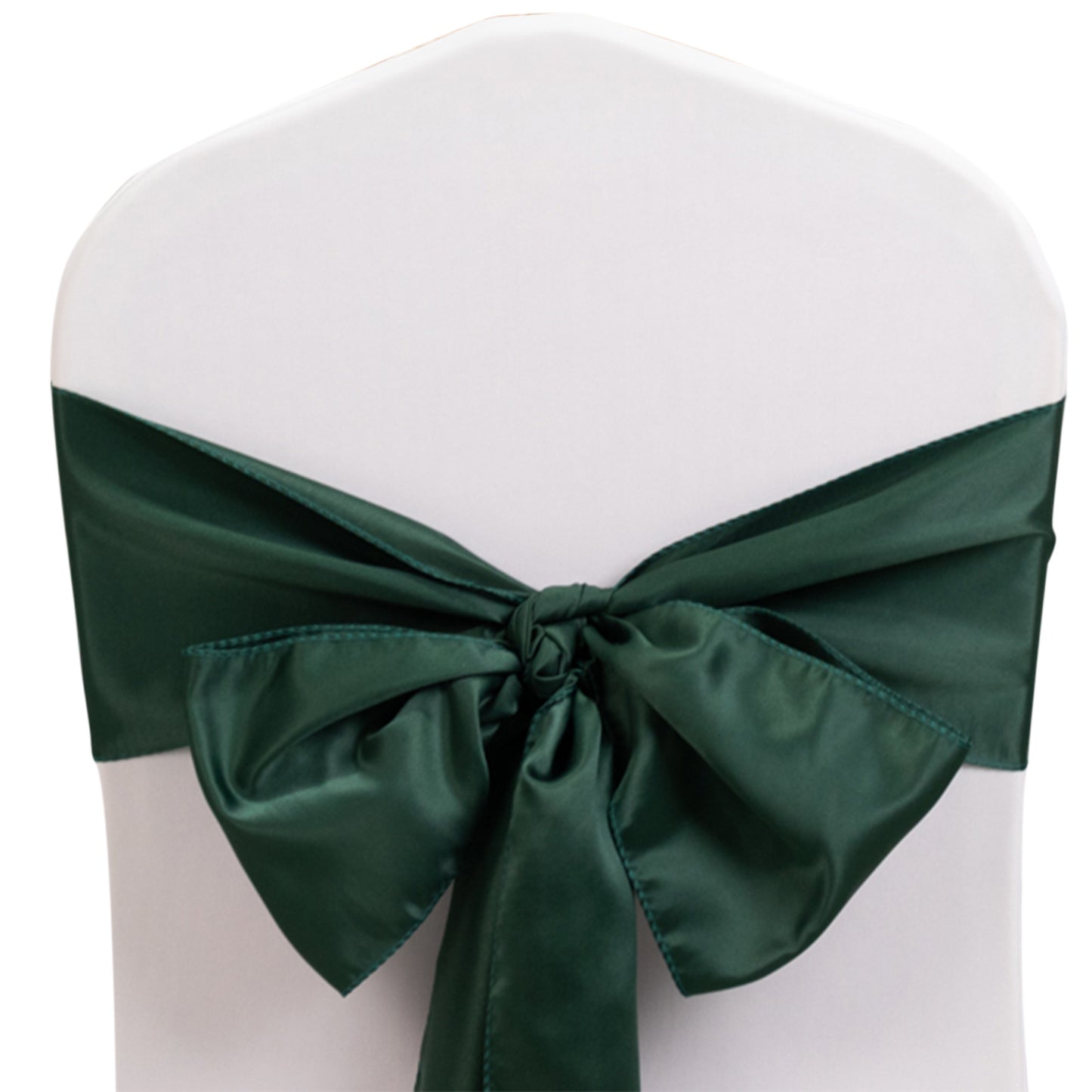 Emerald green satin chair sash tied in a bow on a white chair.