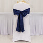 Navy blue satin chair sash bow on a white chair.