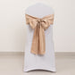 Nude satin chair sash bow on a white chair.
