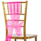 Fuchsia organza chair sash with bow on a gold chair.