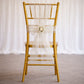 White organza chair sash bow on a gold chair, perfect for weddings.