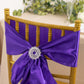 Purple satin chair sash with a silver snowflake buckle and rhinestones.