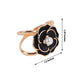 Black pearl floral metal chair sash bow pin with gold rim.