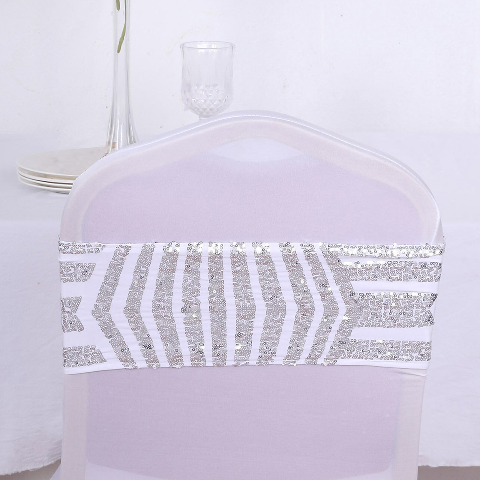 Silver sequin white spandex chair sash with geometric design.