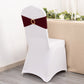 Burgundy spandex chair sash with gold diamond buckle on a white chair.