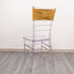 Gold spandex chair sash with diamond buckle on a clear chair.