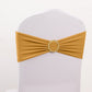 Gold spandex chair sash with diamond buckle on a white chair.