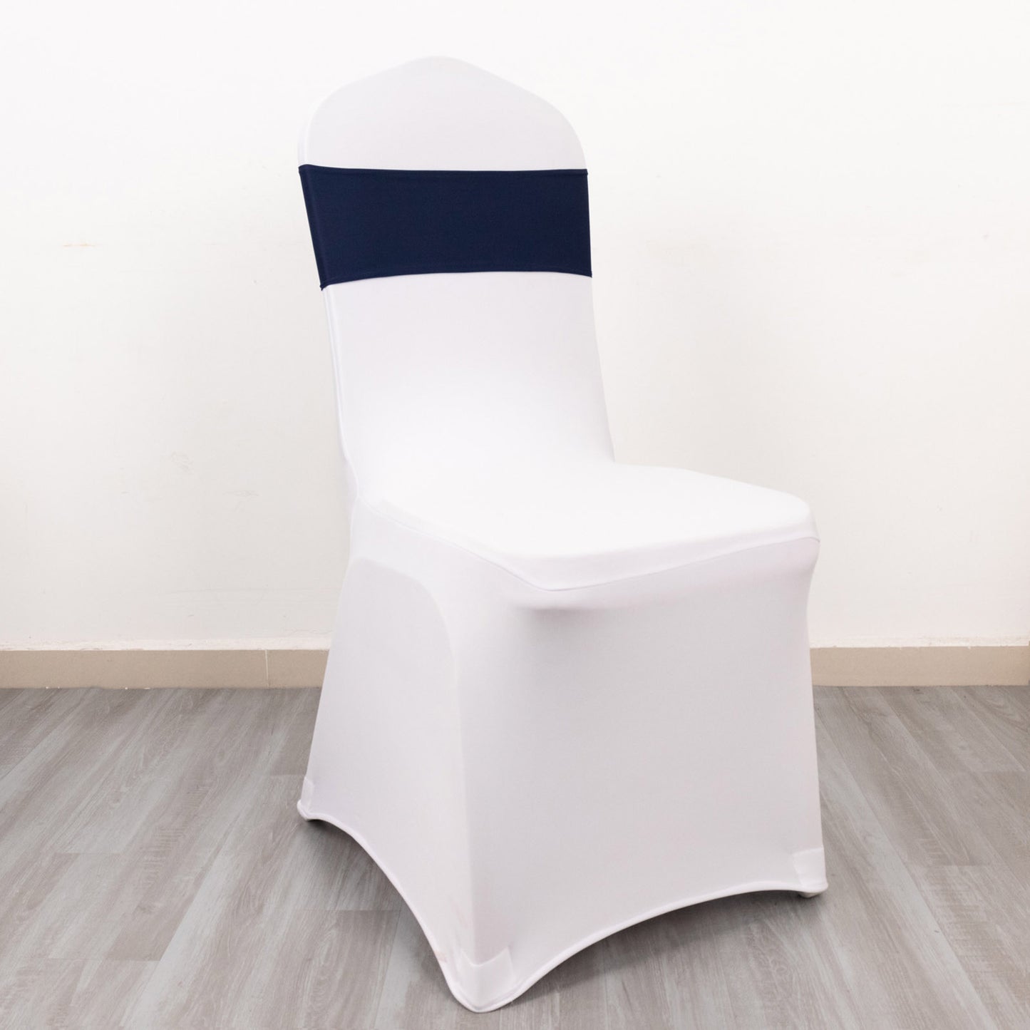Navy blue spandex chair sash with elegant gold diamond buckle.