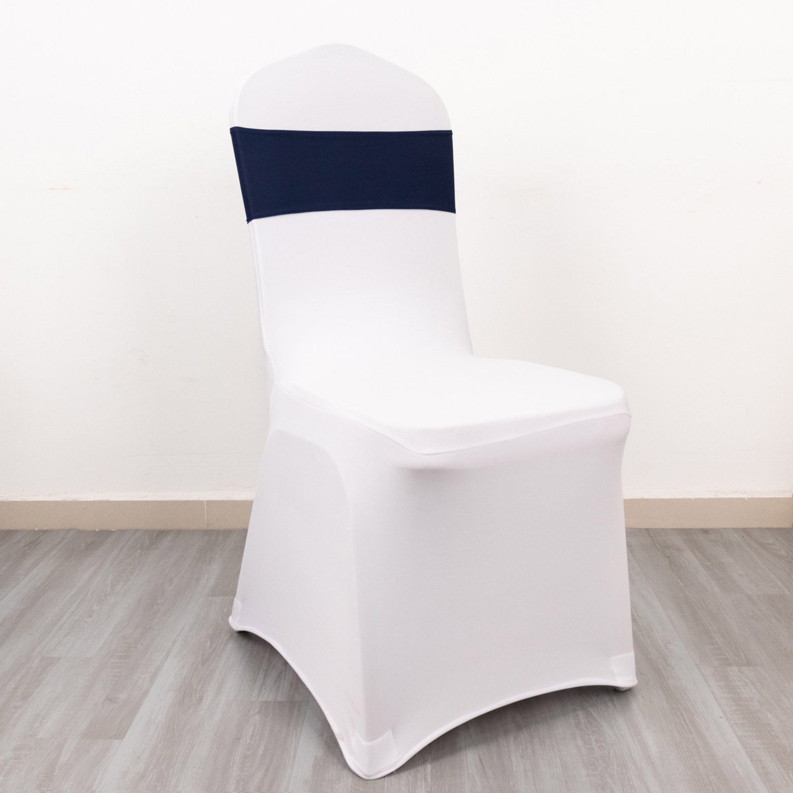 Navy blue spandex chair sash with elegant gold diamond buckle.