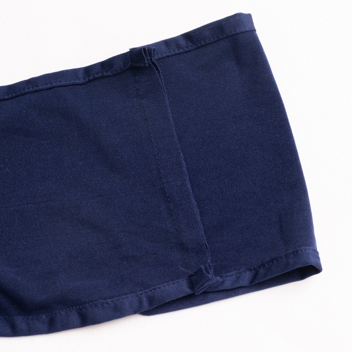 Navy blue spandex chair sash with gold diamond buckle detail.