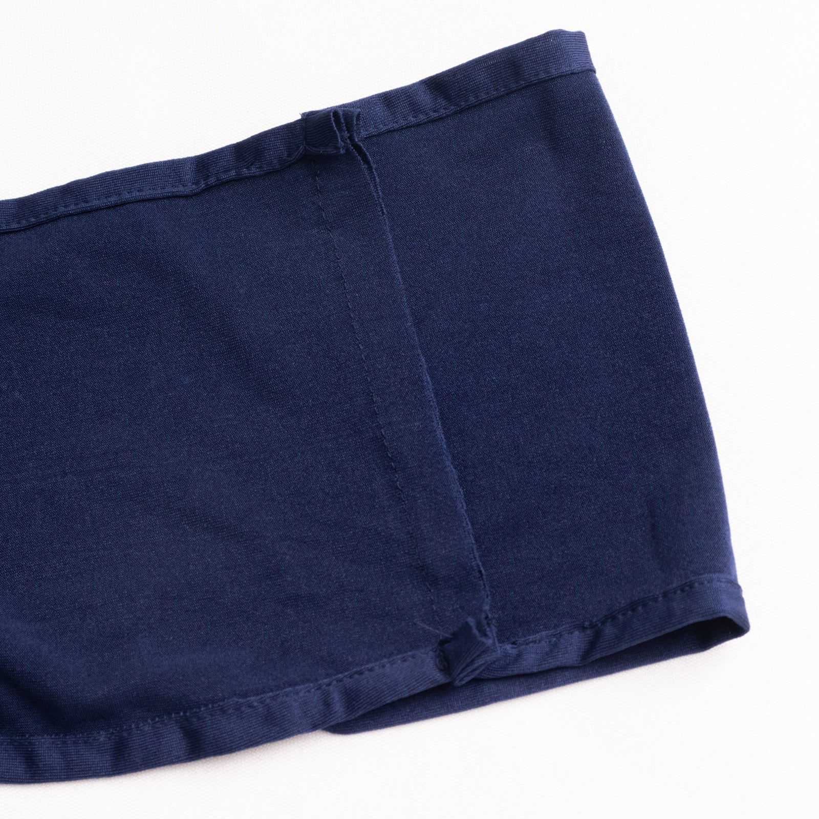 Navy blue spandex chair sash with gold diamond buckle detail.