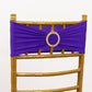 Purple spandex chair sash with gold diamond buckle on a gold chair.