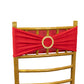 Red spandex chair sash with gold diamond buckle on a golden chair.