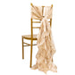 Beige curly willow chiffon satin chair sashes on a gold chair. #whtbkgd