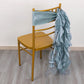 Dusty blue chiffon satin chair sash on a gold chair.