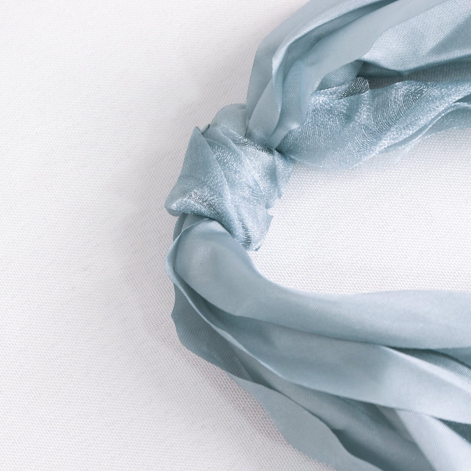 Dusty blue chiffon satin chair sashes in a 5 pack.