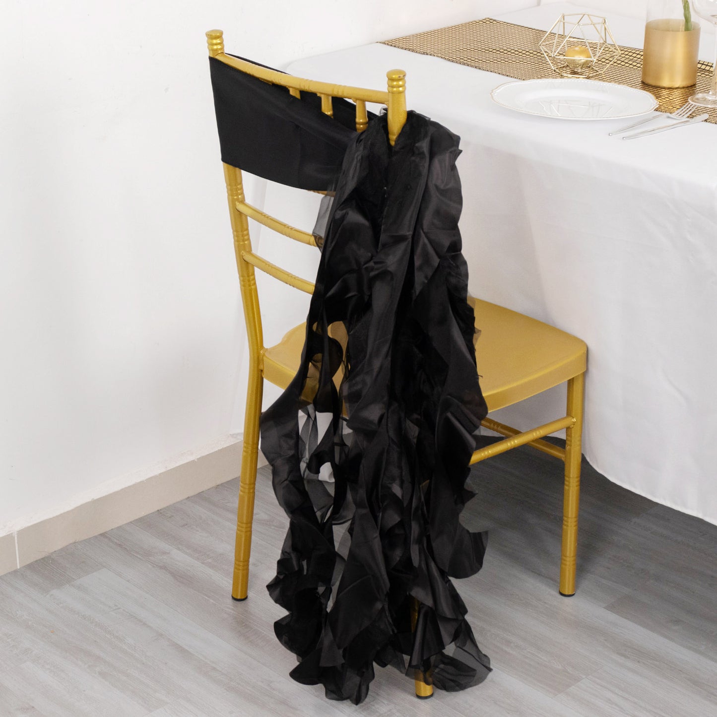 Black curly willow chiffon satin chair sash on a gold chair.