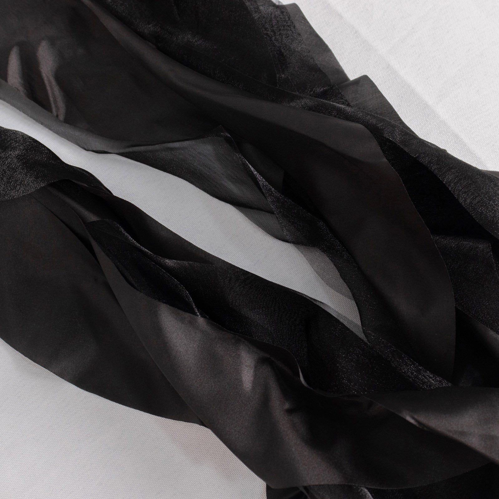 Black chiffon satin chair sashes, perfect for elegant events.