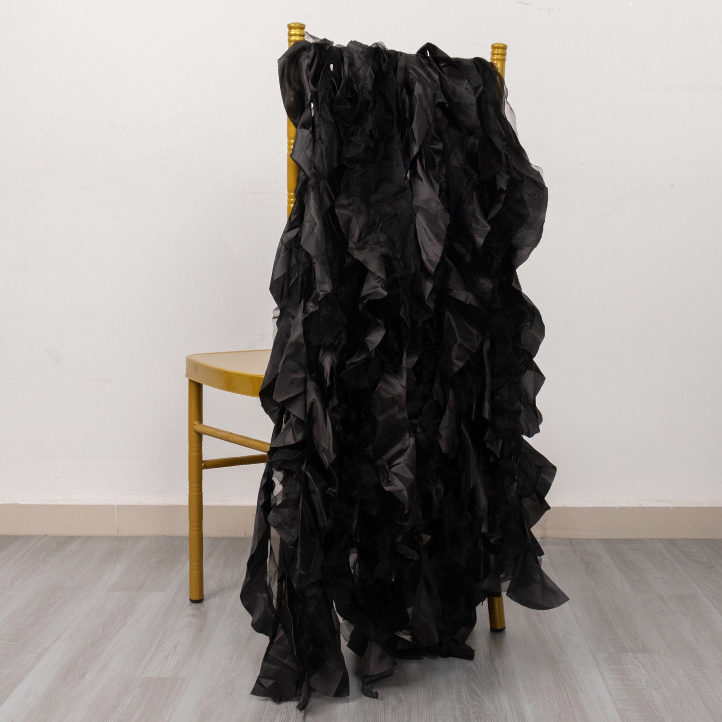 Black Curly Willow Chiffon Satin Chair Sashes on a chair