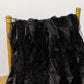 Black curly willow chiffon satin chair sashes draped over a gold chair.