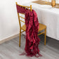 Burgundy chiffon satin chair sash draped on a gold chair.