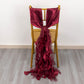 Burgundy chiffon satin chair sash elegantly draped on a gold chair.