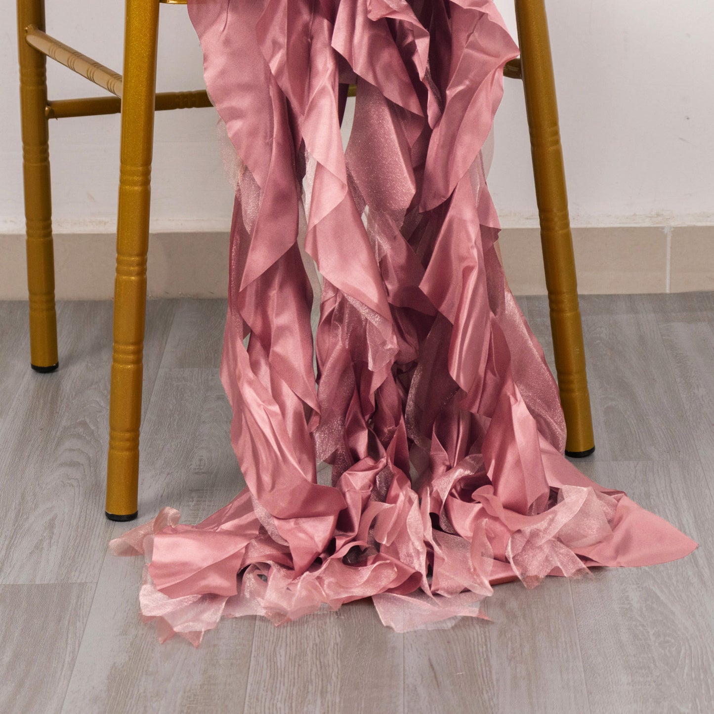 Cinnamon rose curly willow chiffon satin chair sashes draped on a chair.