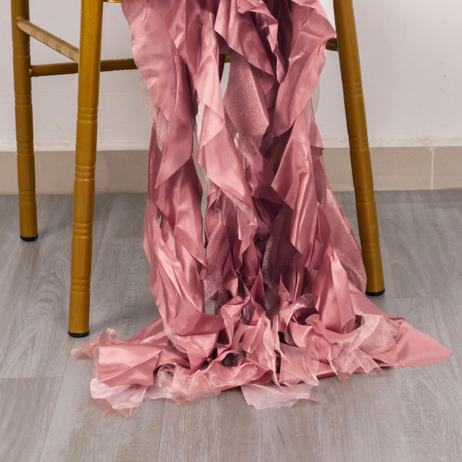 Cinnamon rose curly willow chiffon satin chair sashes draped on a chair.