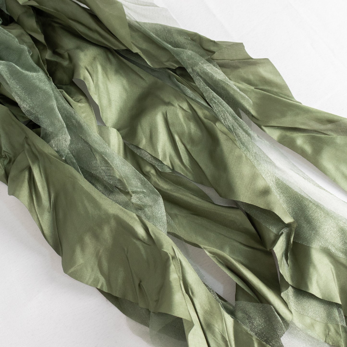 Dusty sage green chiffon satin chair sashes, elegant and flowing.