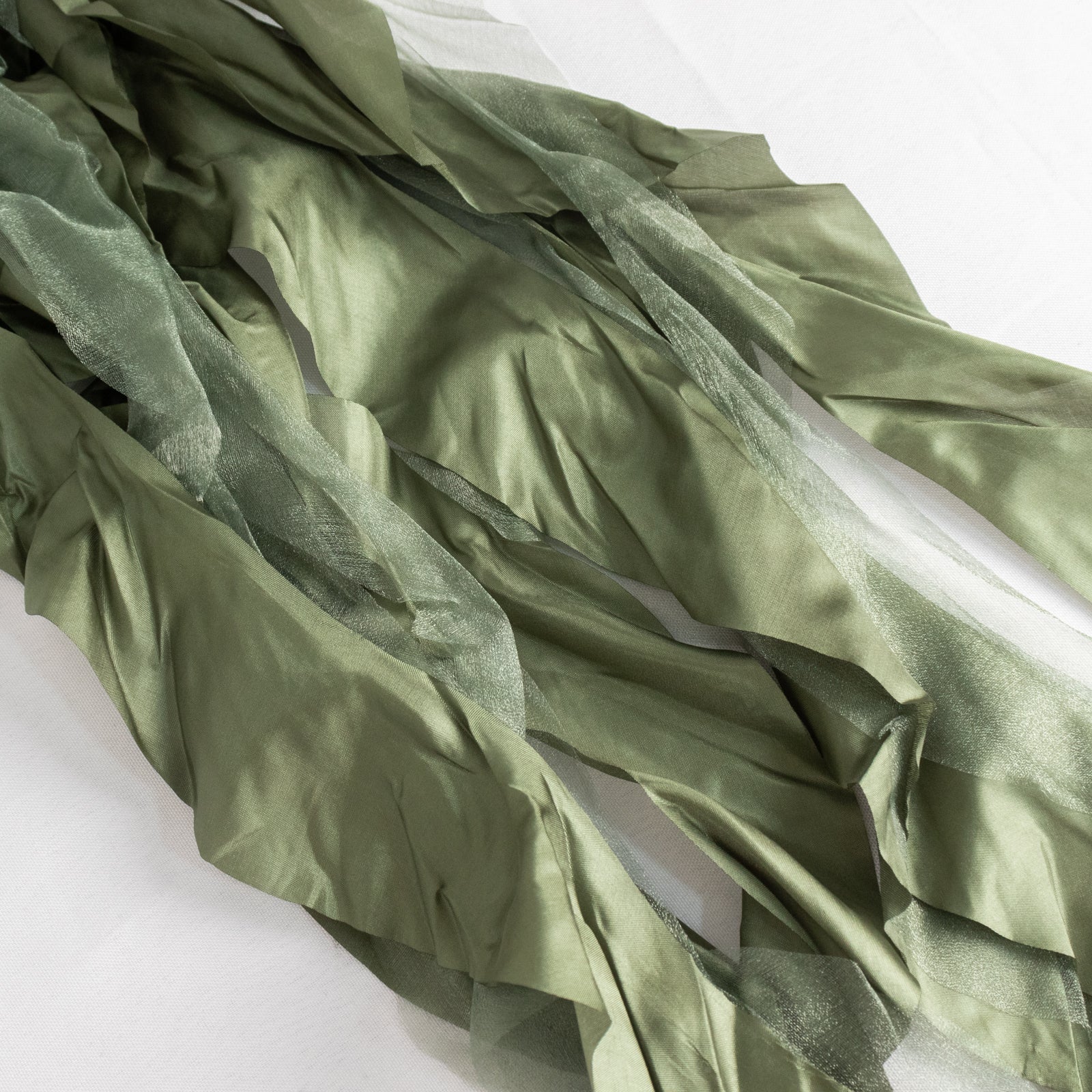 Dusty sage green chiffon satin chair sashes, elegant and flowing.