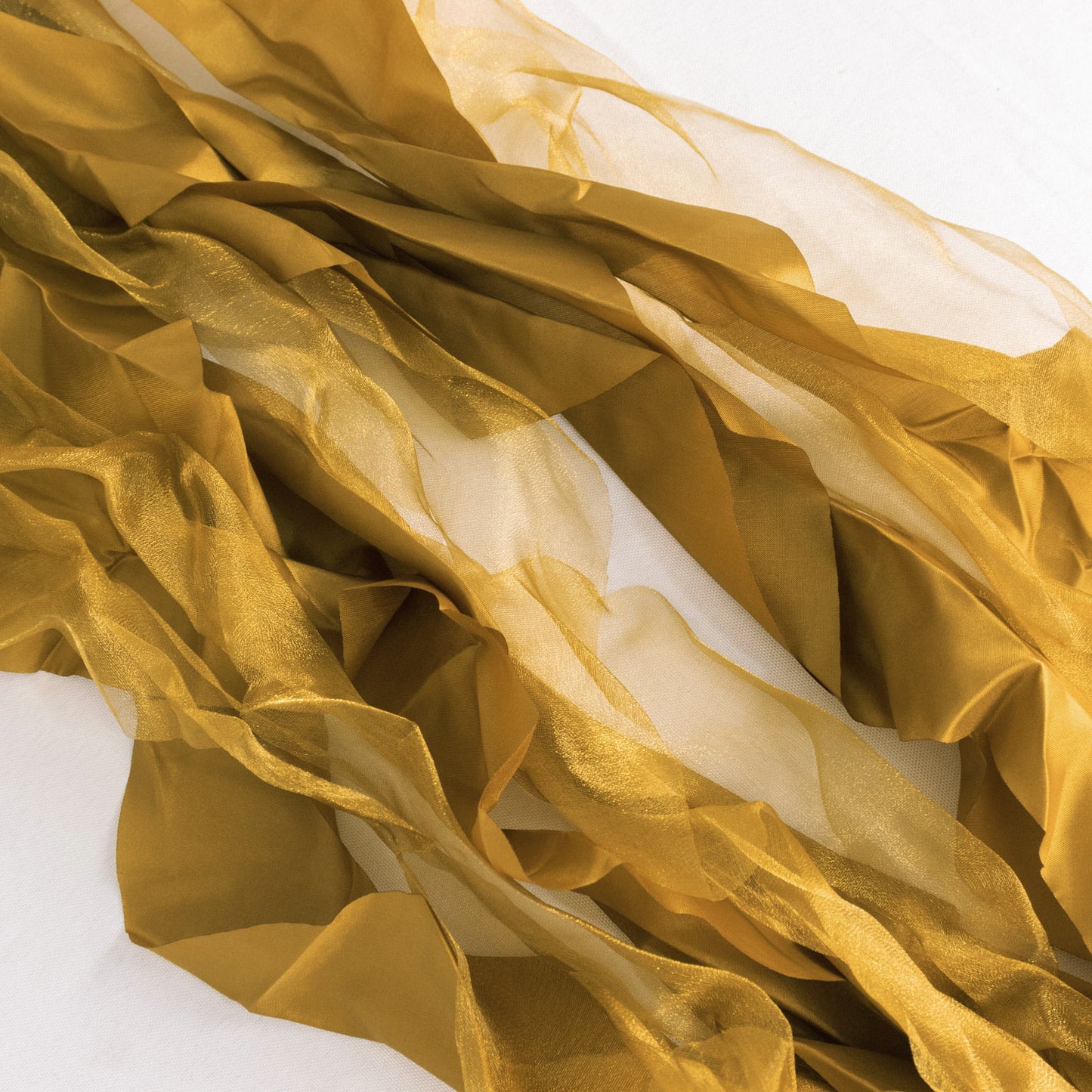 Gold chiffon satin chair sashes, perfect for elegant decorations.