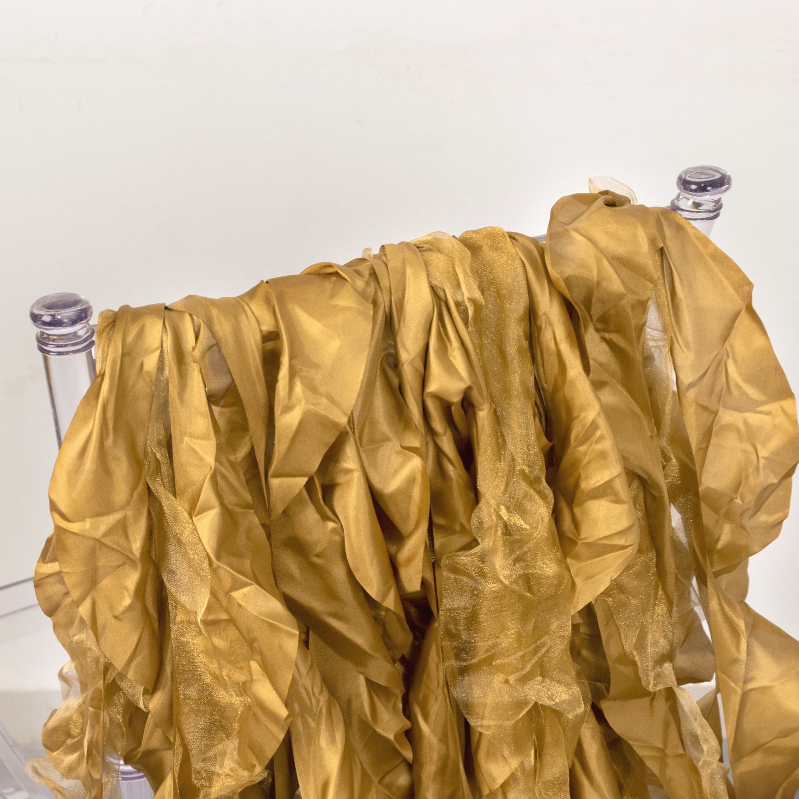 Gold curly chiffon satin chair sashes in a 5 pack.